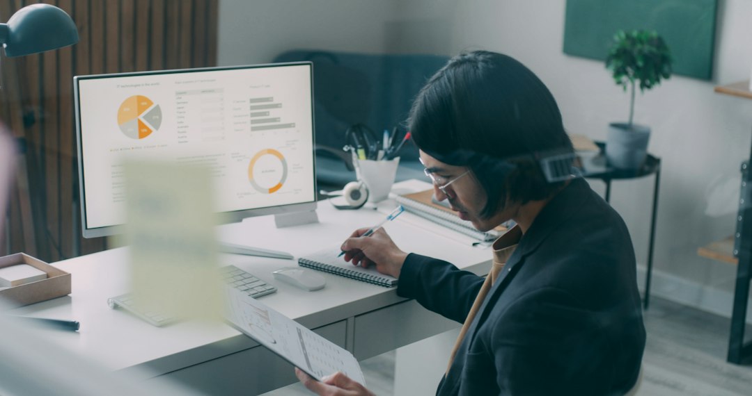 Business professional working with accounting and financial software